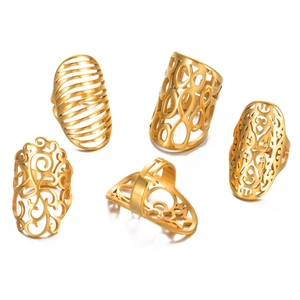 Set of five gold hollow stainless steel rings with geometric floral and star patterns