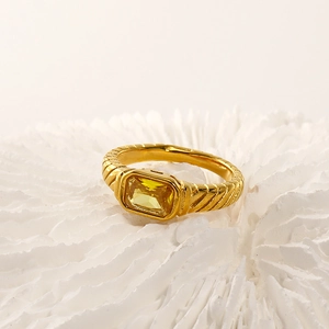 Detailed close-up of a 18k gold plated ring featuring a rectangle yellow zircon stone
