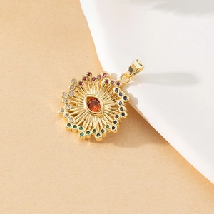 Detailed close-up of golden evil eye pendant with vibrant multicolored rhinestones