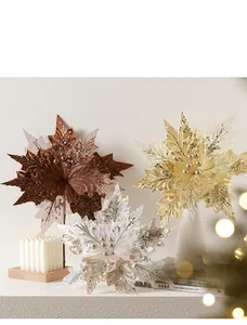 Close-up of three 30cm glitter artificial Christmas flowers in gold, bronze, and silver