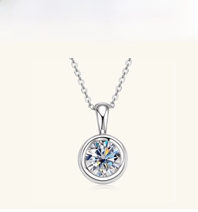 Macro detail of S925 sterling silver necklace featuring a round brilliant moissanite pendant