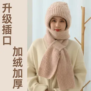 Detail of knit winter hat and scarf set with plush lining and practical slip-through design