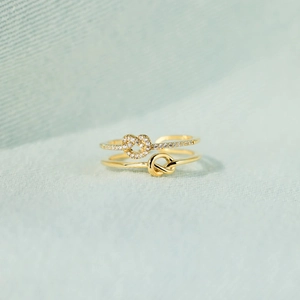 Minimalist double-layer gold S925 silver ring featuring knot and zircon heart design