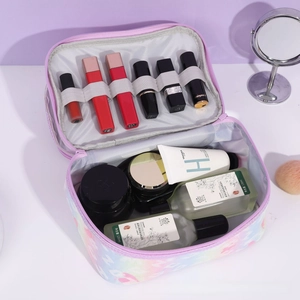 Detail view of the spacious inner compartment and elastic lipstick slots in a makeup bag