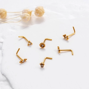 Set of six gold L-shaped stainless steel nose studs with tiny zirconia and round beads