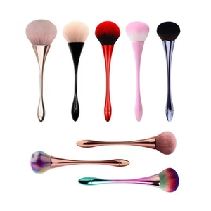 Detailed view of various color cosmetic brushes with metallic handles and soft bristles