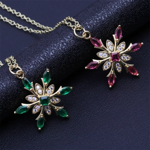 Star-shaped gold necklaces with micro-pave multicolor cubic zirconia floral pendants