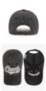 Detail view of washed cotton baseball cap with adjustable metal buckle and inner care label