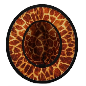Detail view of giraffe pattern hat interior showing the black sweatband and 65% cotton label