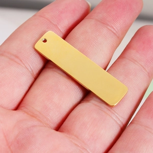 Golden rectangular stainless steel pendant with mirror finish and pre-drilled hole