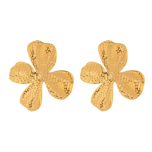 Detail of vintage gold flower earrings featuring hammered metal texture and clover petals