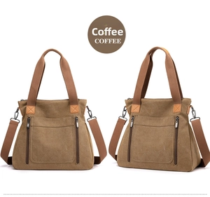 Detailed view of coffee canvas tote bag with front dual zipper pockets and top handles