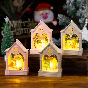 European style LED Christmas lanterns with snowman and Santa illustrations on wooden base