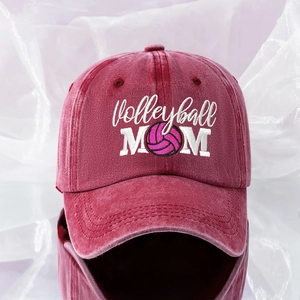 Detail of embroidered Volleyball MOM text and pink volleyball logo on washed cotton cap