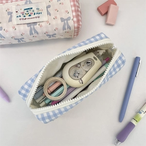 Detail view of large capacity plaid pencil case with spacious internal storage space