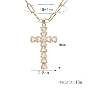 Detailed view of gold cross pendant with cubic zirconia and paperclip chain dimensions