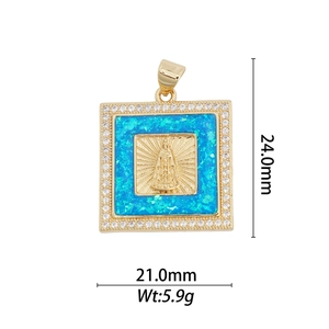 Macro view of 18k gold plated pendant with blue opal, religious icon and size specs