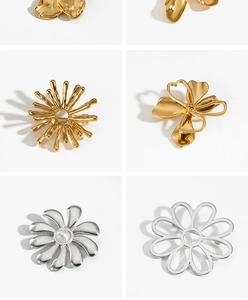 Detailed grid of gold and silver flower brooches with metallic finish and pearl centers