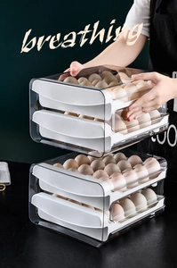Detail of clear double-layer egg container with drawer design and auto-roll slide