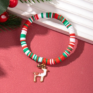 Close-up of Christmas polymer clay heishi bead bracelet with a white reindeer charm