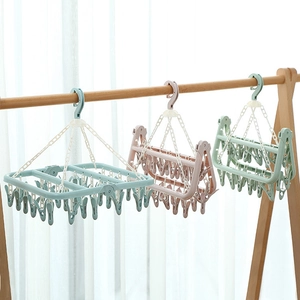 Foldable 32-clip plastic clothes drying rack for socks and laundry in blue pink and green