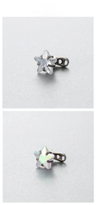 Detailed close-up of 6mm star-shaped zircon dermal anchors in clear and aurora colors