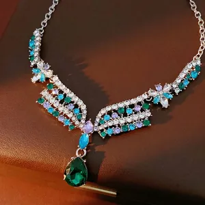Luxury vintage floral necklace featuring colorful rhinestones and a green teardrop pendant