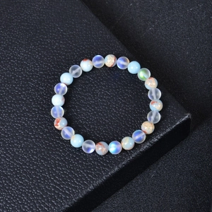 Macro shot of natural stone health bracelet with blue flash and orange textured beads