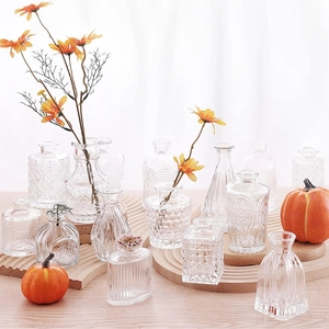 Assorted transparent glass vases with diamond and ribbed patterns for home decoration
