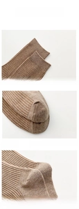 Detail view of khaki cotton socks featuring elastic cuffs and reinforced heel structure