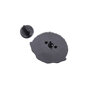 Detailed macro view of the metal pin back and black rubber clutch for enamel pins