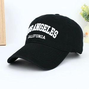 Detail view of 3D embroidered Los Angeles lettering on black cotton baseball cap