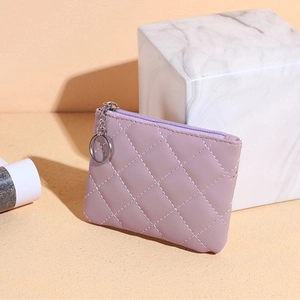 Detail of purple quilted PU leather mini coin purse with silver zipper and key ring