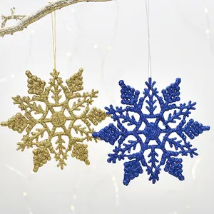Sparkly gold and blue glitter snowflake ornaments for festive Christmas tree decoration