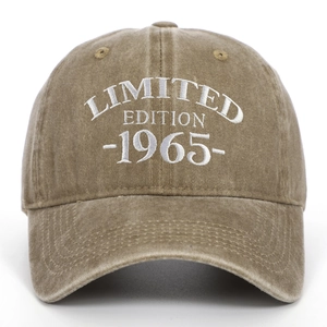 Macro shot of white 1965 Limited Edition embroidery on a vintage washed cotton baseball cap