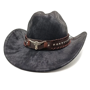 Detail of western cowboy hat with brown leather belt, silver rivets and bull head buckle