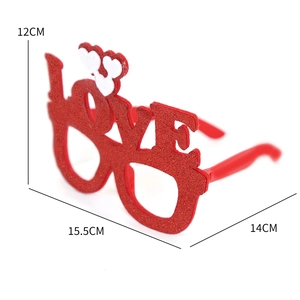 Sparkly red LOVE shaped novelty glasses with white heart accents for party decoration