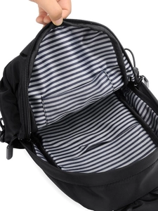 Men's crossbody chest bag with striped lining and internal pocket view