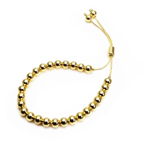 Detail of adjustable slider clasp on 18K gold plated bead bracelet with mirror finish