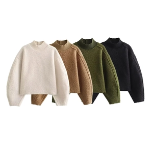 Flat lay of knit sweaters in off-white, camel, olive green, and black color options