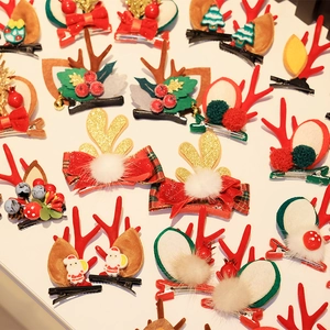 Christmas hair clips collection with reindeer antlers, Santa, and tree elements