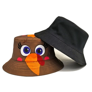 Reversible bucket hat with cute cartoon turkey pattern and solid black cotton fabric