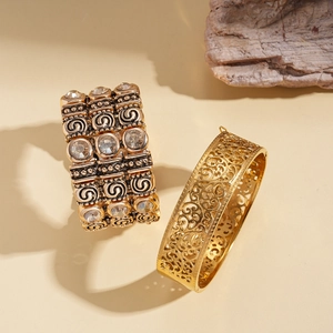 Retro hollow geometric patterns on gold-plated stainless steel bangles with crystal inlay