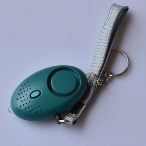 Detail view of cyan portable personal alarm with LED light, key ring and wrist strap