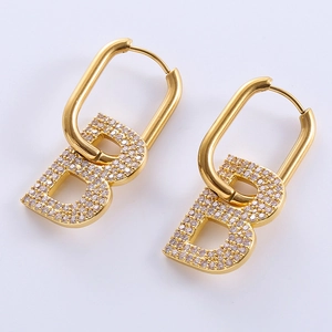 Gold letter B earrings set with sparkling stones and oval hoop clasps for women