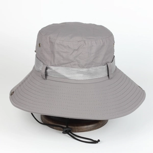 Grey outdoor bucket hat with wide brim, breathable vents and adjustable windproof drawstring