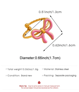 Detail view of pink bow ring with dimensions and polished stainless steel texture