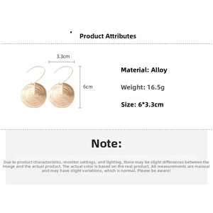 Detailed view of golden textured round drop earrings with dimensions and material specs
