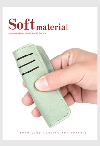 Detail view of a soft light green PU leather card holder with multiple slots