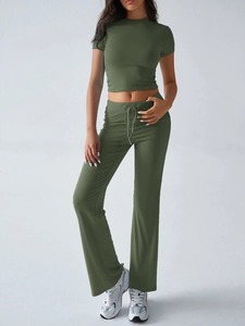 Detailed texture of army green two-piece casual set featuring crop top and flare pants
